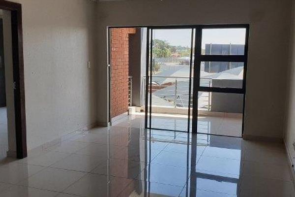 Fully tiled modern apartment consisting of 3 large bedrooms, 2 full bathrooms both with ...