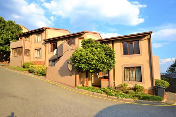 Spacious 2 bedroom townhouse, each bedroom tiled with built in cupboards. A large tiled ...