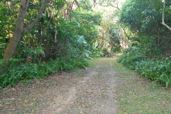 Vacant level land in Leisure Bay, measuring 1,032 square meters. The stand is covered in ...