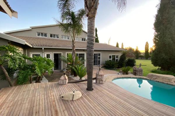 A home that speaks a different language.  From the porte-cochere, enter through the impressive wooden front door to the large entrance ...