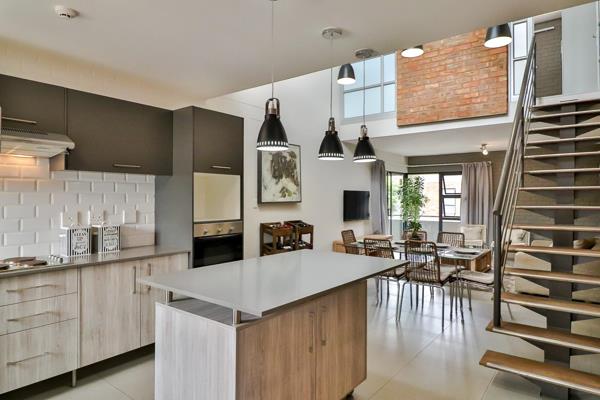 This stunning double volume apartment with modern and rustic finishes in a small ...