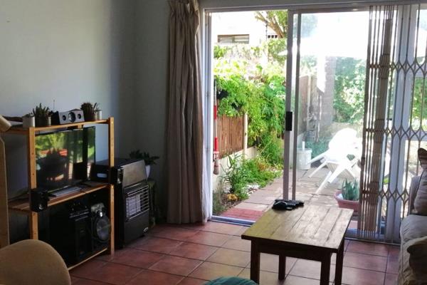 This secure 2 Bedroom Townhouse with 2 dedicated Parking Bays is located in a secure ...