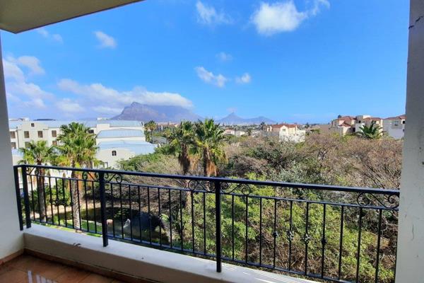 A neatly presented 2 bed apartment in the Palm Springs building with views of Table ...