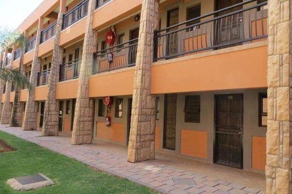 Furnished Bachelor Flat, 
Open plan bedroom with air-conditioner. Kitchen with built-in ...