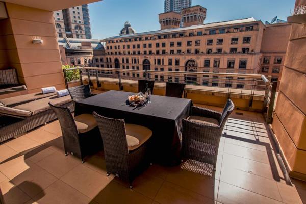 Over looking the Nelson Mandela Square in the heart of Sandton, quietly nestles the ...