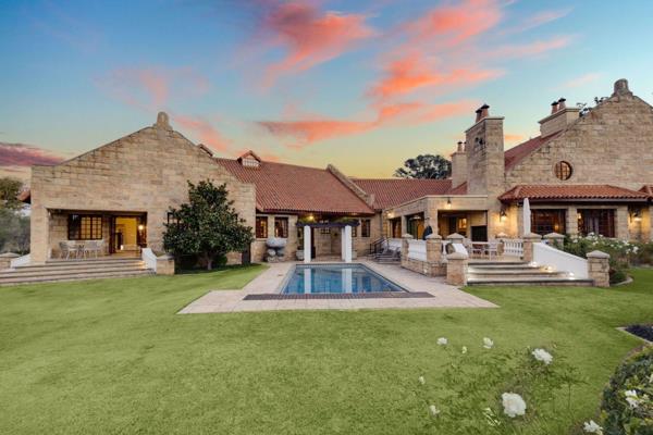 Modern sandstone farmhouse, inspired by Herbert Baker design. Port-cochere front entrance. One of the most prestigious homes in Blair ...