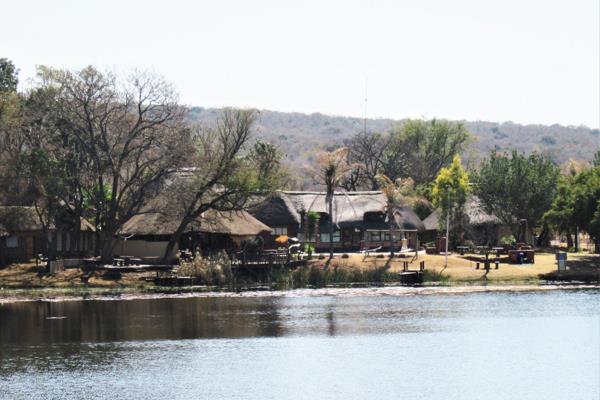 NYLSTROOM: 480 Ha Game/Guest farm . Ideal for adventure camps. 150 km from Pretoria. The lodge has a thatch roof and consists of an ...