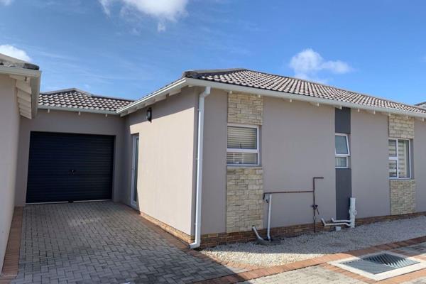 This lovely and modern lock up and go townhouse offers open plan living space, a beautiful kitchen and a built in braai on the patio ...