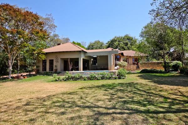 This beautiful home offers a formal lounge and dining room with dual fireplace and leads onto a huge covered patio and beautiful treed ...