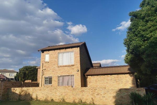 This spacious open plan home has a  kitchen with ample cupboard space.  There is more than enough room to a add a large dining table ...