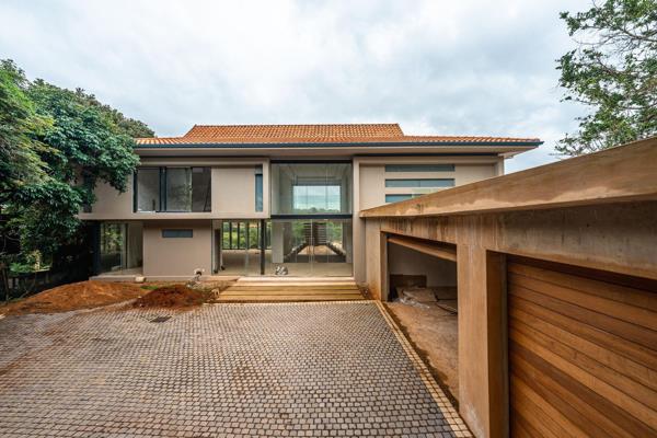 Nearing completion this sophisticated home is positioned at the end of a cul de sac and benefits from both privacy and tranquil forest ...