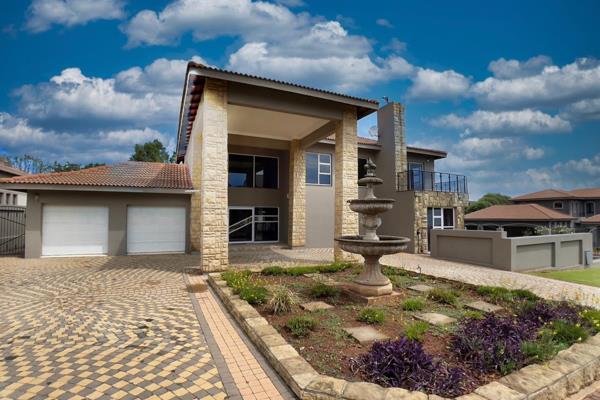 Offering a grand entrance with a stunning feature wall. 
Two lounges, entertainment patio with built-in braai overlooking a sparkling ...