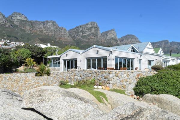 EXCLUSIVE MANDATE 

Nestled on the pristine shores of Beta Beach in Camps Bay, this rare coastal retreat offers an unparalleled ...