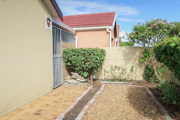 This Separate entrance offers a spacious kitchen with ample storage space that leads to the bedroom with knotty pine ceiling ideal for ...