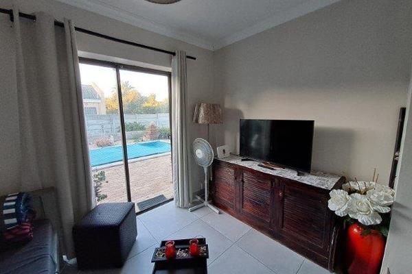 Sunny tiled 1 bedroom separate entrance flat
1 bedroom with sliding door to shared garden and pool
Separate bedroom with full ensuite ...