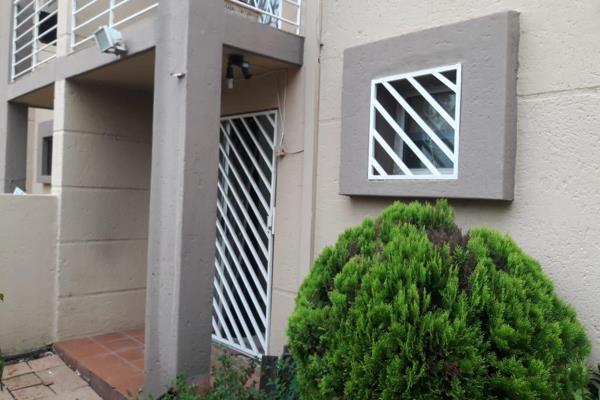 Secure 1 bedroom ground floor unit with private garden townhouse in Sandton CBD. ...