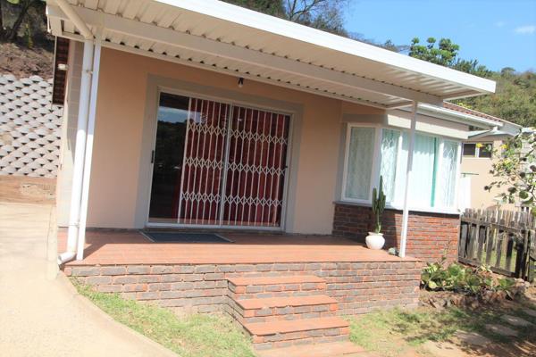 Granny Cottage with a private entrance offering two double bedrooms with built-in cupboards, the main bedroom has an air-conditioning ...