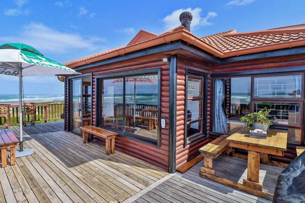 This wooden splendour is situated in a secure estate with remote control access. 

The property consists of 6 bedrooms, 4 bathrooms (2 ...