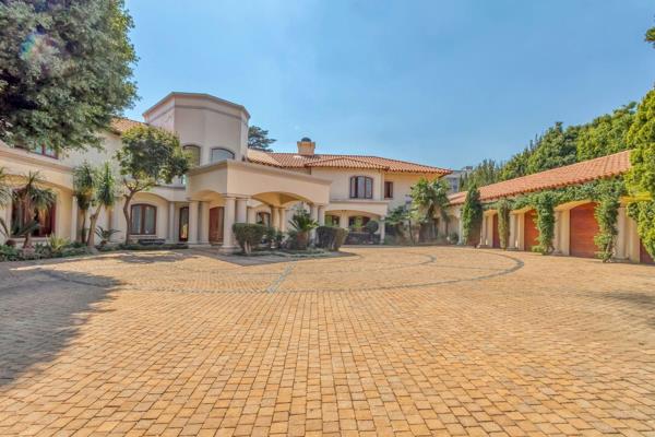 Walk into this double volume entrance with chandeliers and sweeping staircase, setting ...