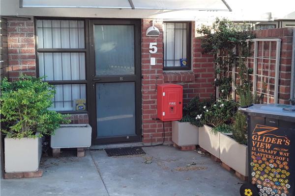 Secure complex with remote  control Security   gates , pot plant garden at the front ...