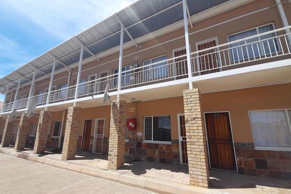 Available 1 April 2025!

1 bedrooms available with a study desk at R2700 per month
Kitchen with a fridge, microwave, and small 2 plate ...