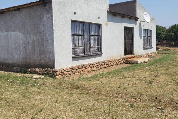 Three bedroom House with one Bathroom and Two outside room with Jojo for water .