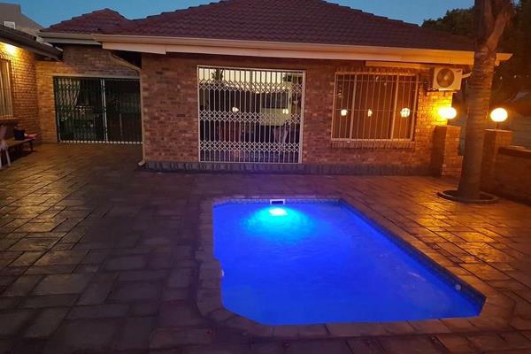 Face brick house with four bedrooms and three bathrooms.  Pool and many more excellent features to have in a holiday home...  

This ...