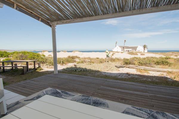 Beautifully set on top of the dune, bordering a green zone overlooking the beach, this ...