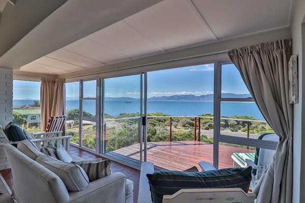 Come view this one-of-a-kind coastal home with permanent ocean views in De Kelders! 
The ...