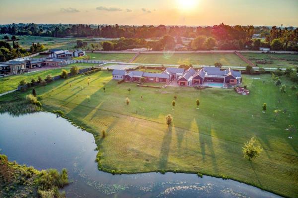 View by Appointment: Discover the epitome of equestrian elegance at this stunning estate, nestled on [insert acreage] of beautifully ...