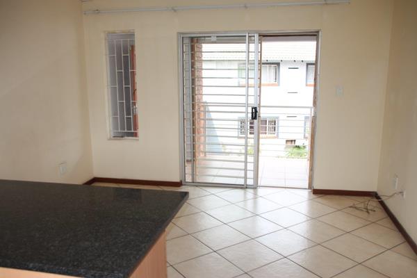 This apartment has an open plan kitchen/family room which opens onto a covered balcony, 2 bedrooms and a full bathroom. The kitchen has ...