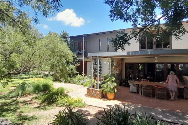 This classic, architect designed 2-storey house on top of a hill in the Crocodile River ...