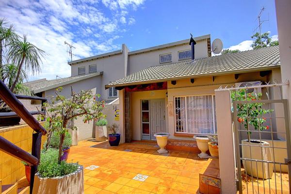 This charming three-bedroom townhouse is nestled in a desirable complex, surrounded by ...