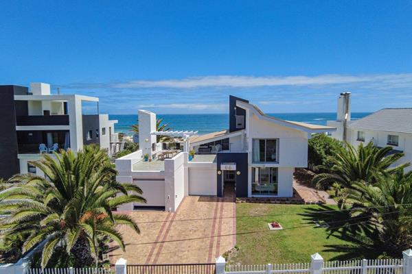 This architecturally designed beachfront villa is a rare opportunity to own a luxurious ...