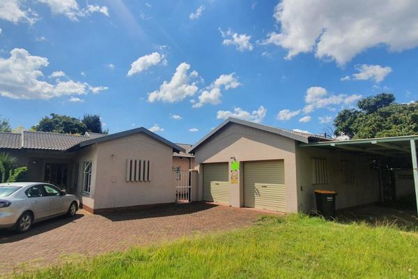 This lovely home Features -
Formal lounge leading out onto covered patio.
Dining room area and
Family room.
Cherry wood kitchen ...