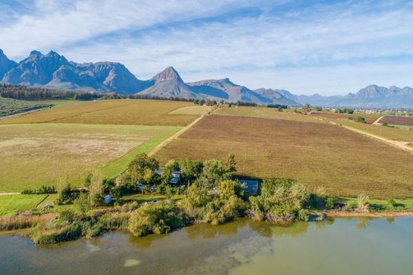 A working wine farm surrounded by mountains with a breathtakingly view over the farm dam. The property is in close proximity of all ...