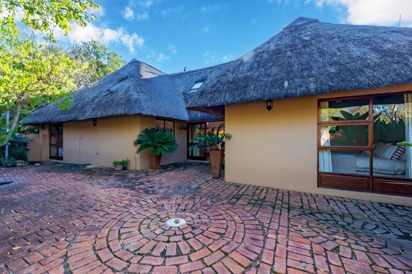 Relaxed living with a outdoor oasis... Escape to the countryside, to a thatched home set in a bushveld garden. This resort-feel estate ...