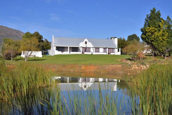 Welcome to this breathtaking farm nestled against the mountains, located just 11 ...