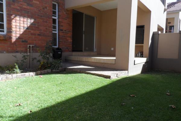 Spacious ground floor townhouse with a patio and a built in braai and private garden that is situated in Rynfield, Benoni. 

The lounge ...