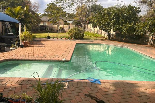 Welcomed by a green manicured garden, trees, plants, vegetable garden and fruit trees., behind precast walls and a motorized gate. ...