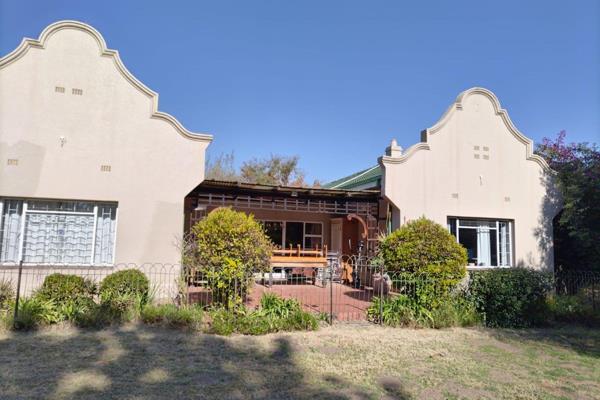 Step into this exquisite and sun-kissed abode, reminiscent of a charming farm-style retreat, nestled securely within the tranquil ...