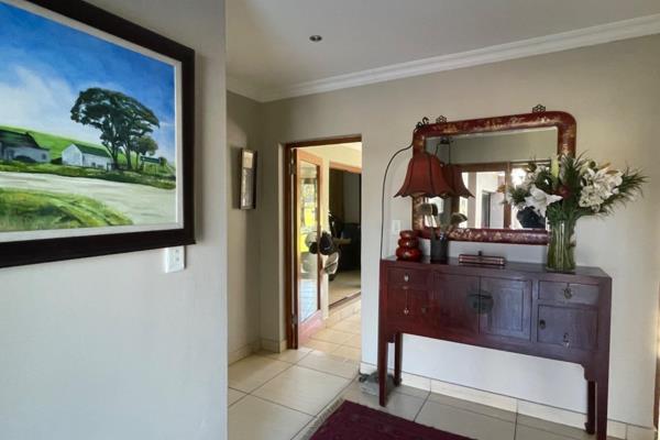 A spacious entrance hall provides access to the heart of the house. The kitchen and TV area (with a fire place) are open plan and are ...