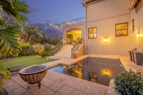 Nestled in the heart of Northcliff on a secluded panhandle, this exquisite Tuscan-style ...