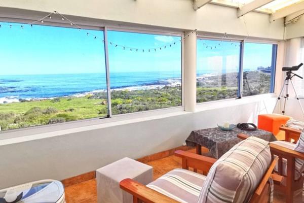 Embrace tranquility in this low-maintenance 5-bedroom home where the ocean meets the ...