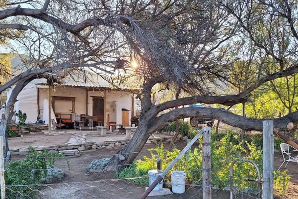 Introducing a remarkable opportunity to embrace the idyllic lifestyle of owning a working Karoo farm. Nestled amidst the picturesque ...