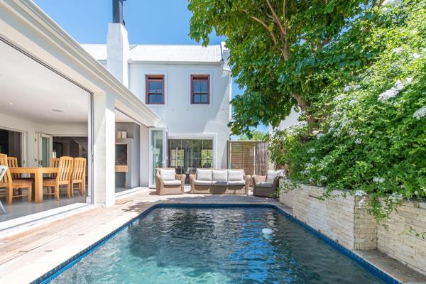 This lovely and spacious home is situated on a corner plot, offering a beautiful pool for the main house as well as a quaint splash ...