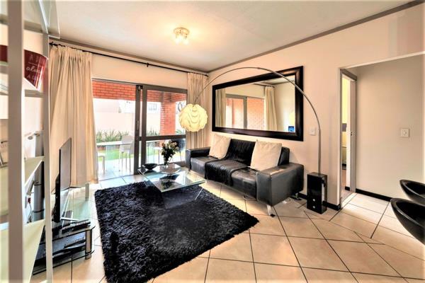 As you enter this lovely townhouse, you are greeted by the spacious open plan tiled ...