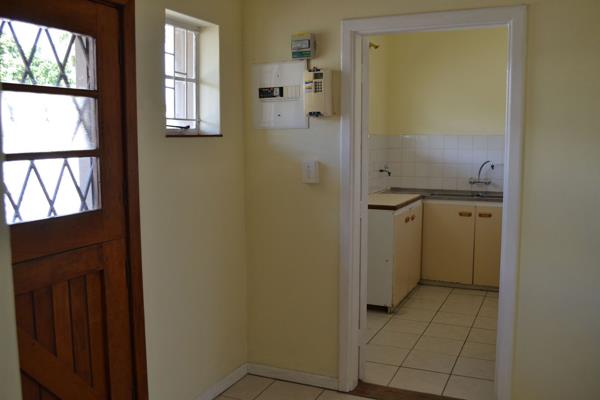 You will find the kitchen with a couple of freestanding cupboards with no stove.

A ...