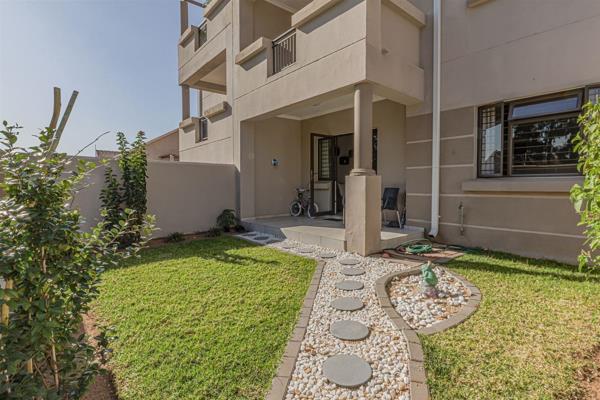 Upmarket 2 bedroom, 1 bathroom ground floor apartment with covered patio and garden, featuring: fitted open-plan kitchen with Caesar ...