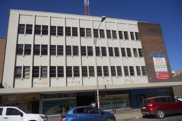 Building consisting of shops and offices for sale